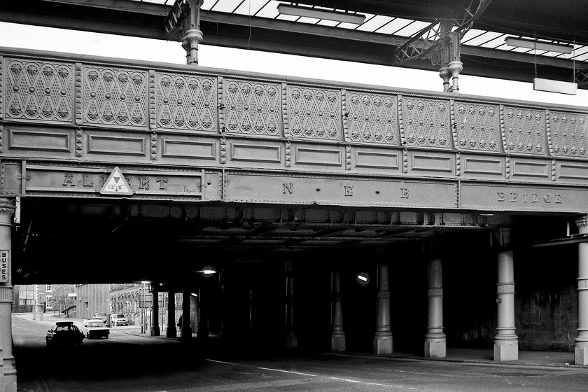 Albert Bridge, Middlesbrough 
 The fine and ornate cast-iron bridge that carries the railway and the station over Middlesbrough's Exchange Place was designed by the North Eastern Railway's chief architect William Peachey and was constructed in 1877. It is a target for regular bridge strikes given its 13' 6" limited clearance, indeed, putting the name into a search engine reveals many examples of busses and lorries hitting the structure over the years. 
 Keywords: Albert Bridge, Middlesbrough