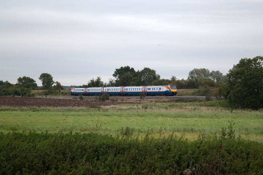 Class 222, EM 07.58 London St. Pancras-Sheffield (1F10, 2E), Radwell TL008569 
 An unidentified class 222 works the 07.58 St. Pancras to Sheffield past Radwell in Bedfordshire. It has just crossed the River Great use and is about to start its accent of Sharnbrook bank, five miles of steady climbing ranging from 1:200 to a considerable stretch of 1:100. 
 Keywords: Class 222 07.58 London St. Pancras-Sheffield 1F10 Radwell TL008569