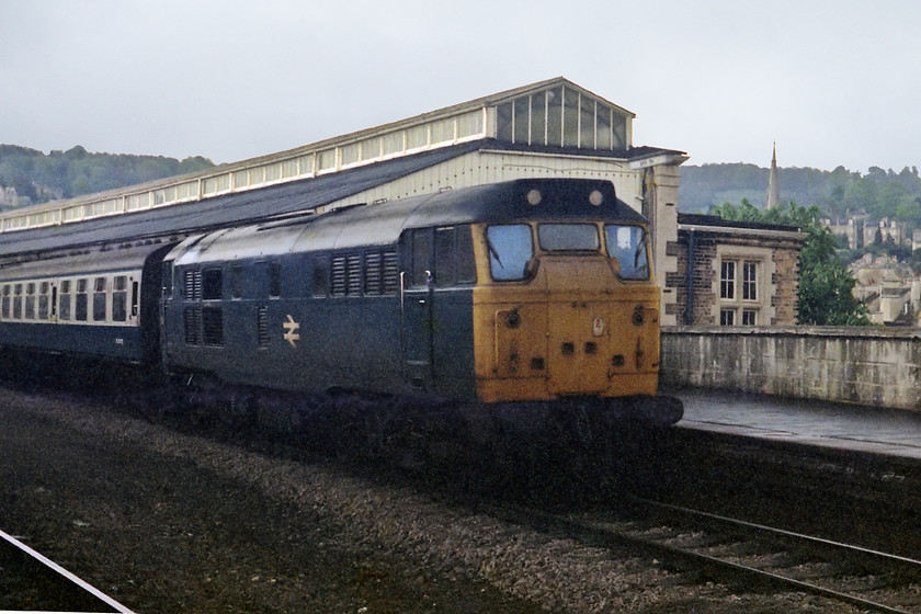 31240, unidentified Portsmouth Harbour-Bristol Temple Meads working, Bath Spa station 
 The blue sky and fine weather from earlier have given way to some very heavy showers. 31240 waits under rain leaden skies with a Portsmouth Harbour to Bristol Temple Meads working at Bath Spa. 31240 was not a local locomotive to the West Country, so I expect that's why I thought it worthy of a picture. 
 Keywords: 31240 Portsmouth Harbour-Bristol Temple Meads working Bath Spa station