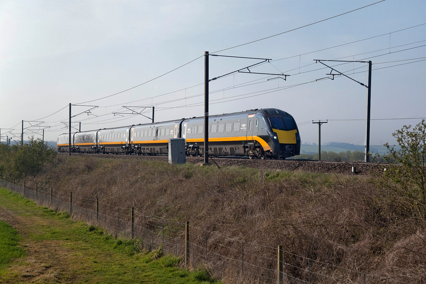 180102, GC 08.06 London King`s-Cross-Sunderland (1N90, RT), Frinkley Lane crossing SK906436 
 In glorious spring sunshine, 180102 works the 08.06 King's Cross to Sunderland 1N90. It is seen approaching Frinkley Lane crossing about five miles north of Grantham. Whilst the crossing is now just for pedestrians it is shown on my 1980 Ordnance Survey Landranger map as being a proper level crossing for a minor (white) road running between the villages of Hougham and Honnington. 
 Keywords: 180102 08.06 London King`s-Cross-Sunderland 1N90 Frinkley Lane crossing SK906436