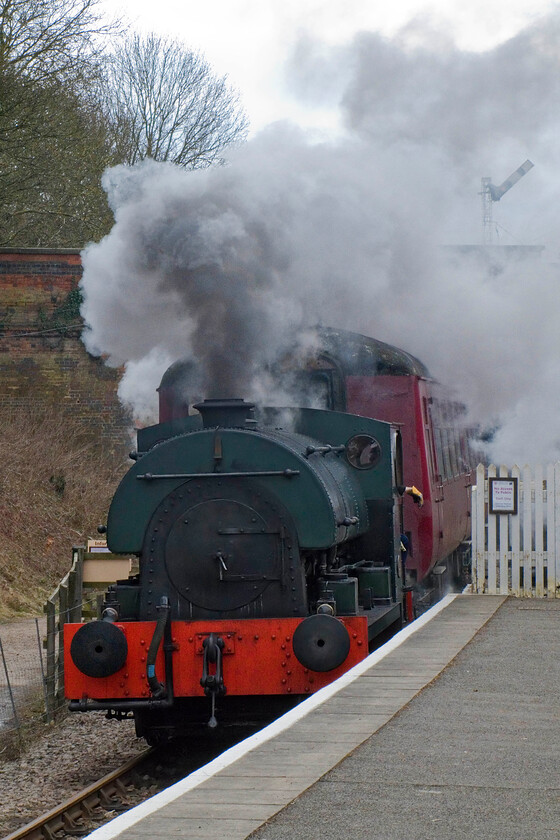 2104, 12.30 Pitsford & Brampton return, Pitsford & Brampton station 
 0-4-0 Peckett 2104 has been on the Northampton and Lamort Railway since 1989 prior to that being operational on Buckinghamshire Railway Centre at Quainton Road arriving there from industrial use at Croydon Power station in December 1972. It is seen here making quite a sight for such a diminutive locomotive arriving at Pitsford and Brampton station with the 12.30 return working. 2104's boiler certificate expires in the next couple of years so a decision is going to be made about its future soon. 
 Keywords: 2104 12.30 Pitsford & Brampton return Pitsford & Brampton station Peckett