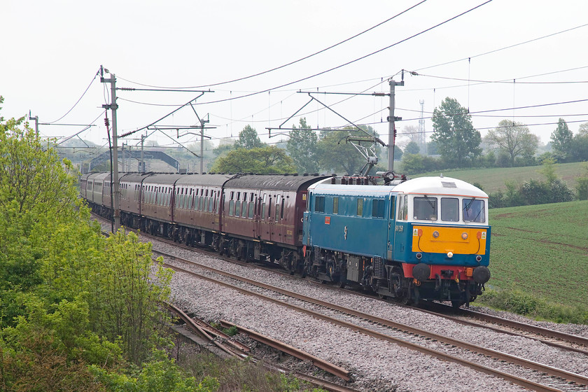 86259, outward leg of The Cumbrian Mountain Express, 07.10 London Euston-Carlisle (1Z86), Blisworth 
 86295 'Les Ross/Peter Pan' leads a nice set of WCRC Mk. 1 stock forming the outward leg of The Cumbrian Mountain Express. It is seen passing Blisworth as 1Z86, 07.10 Euston to Carlisle. It's a shame that it was such a dull morning, but, had the sun been shining this shot would have been quite badly back-lit. I should be grateful for small mercies I suppose! 
 Keywords: 86259 The Cumbrian Mountain Express 07.10 London Euston-Carlisle 1Z86 Blisworth