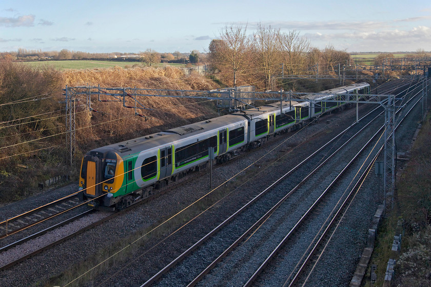 350126, LN 13.13 London Euston-Birmingham New Street (1Y39, 1L), Victoria bridge 
 It's just gone 14.00 and already the low cutting at Victoria bridge just south of Roade in Northamptonshire is in shadow. Careful use of Photoshop has enabled a reasonable image of 350126 on the 13.13 Euston to Birmingham New Street to be produced. Only three weeks until the shortest day! 
 Keywords: 350126 13.13 London Euston-Birmingham New Street 1Y39 Victoria bridge