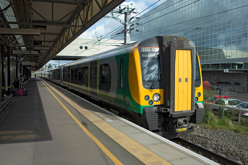 350113 & 350124, LM 08.33 Birmingham New Street-London Euston (1W06, 1L), Milton Keynes Central station 
 The 08.33 Birmingham New Street to London Euston arriving into Milton Keynes station formed of 350113 and 350124. My wife and son can be seen sitting on the otherwise empty platform one. 
 Keywords: 350113 350124 1W06 Milton Keynes Central station