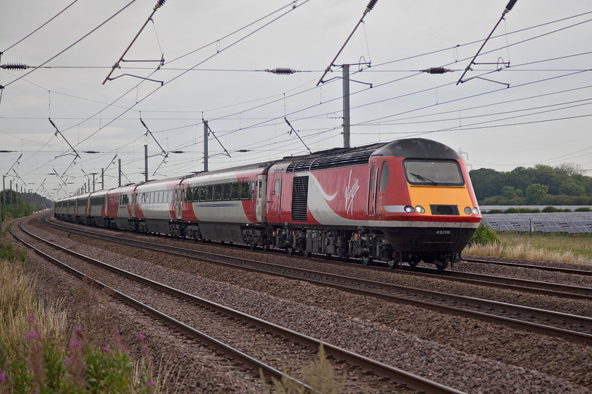 43206, GR 05.40 Sunderland-London Kings Cross (1Y08, 2E), Sandy TL176510 
 An HST at full chat on the ECML is something that we have all become familiar with over the last forty years. But, it's one that will be coming to end soon as things evolve again. 43206 leads the 05.40 Sunderland to King's Cross past Sandy's unusually named New Zealand footbridge. 
 Keywords: 43206 1Y08 Sandy TL176510