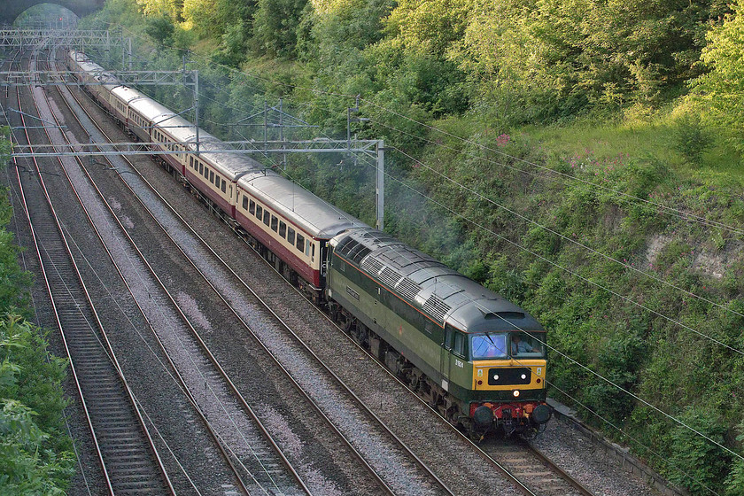 D1924, return leg of The Crewe Open Day & The Medieval Chester, 15.35 Crewe-London Euston (1Z42), Hyde Road bridge 
 After the drama of the morning run with D1944 'Craftsman' failing within ten minutes of leaving Euston over, D1924 'Crewe Diesel Depot' brings the return working through Roade cutting. Disgraced D1944 is dead-in-tow on the rear of the train that is returning from Chester and Crewe following the open day at Locomotive Services Ltd. base at Crewe diesel depot. As can be seen, after a foul day, some late evening sun has just broken through the cloud to illuminate the very top of the cutting. 
 Keywords: D1924 The Crewe Open Day The Medieval Chester 15.35 Crewe-London Euston 1Z42 Hyde Road bridge