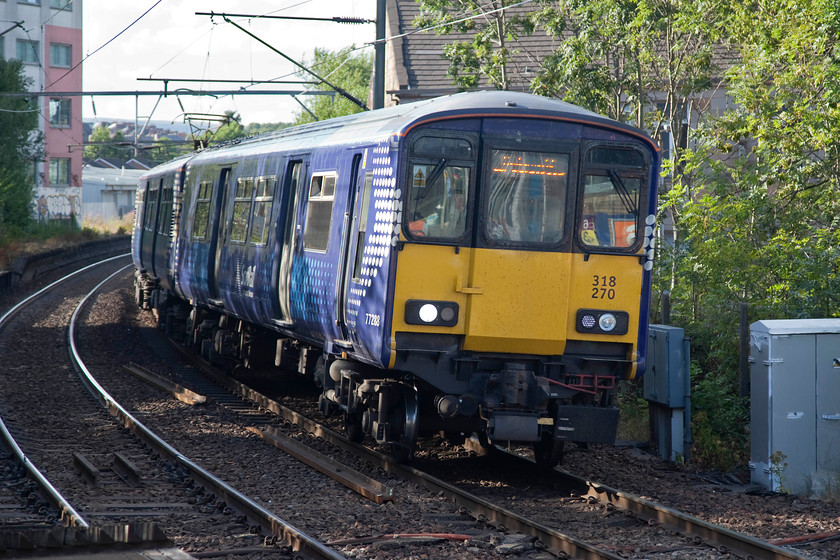 318270, SR 17.56 Dumbarton Central-Cumbernauld (2V46, RT), Partick station 
 ScotRail 318270 arrives at Partick station working the 17.56 Dumbarton Central to Cumbernauld. Partick station, just to the west of the city centre on the north bank of the Clyde was particularly busy at this time of the evening. Unfortunately, for these commuters most trains heading east were quite heavily delayed, the reason being given by the automated announcers was the 'cover all' of 'operational difficulties'. I think that I would rather not have any reason given but that one that, when you actually think about it, means very little! 
 Keywords: 318270 2V46 Partick station