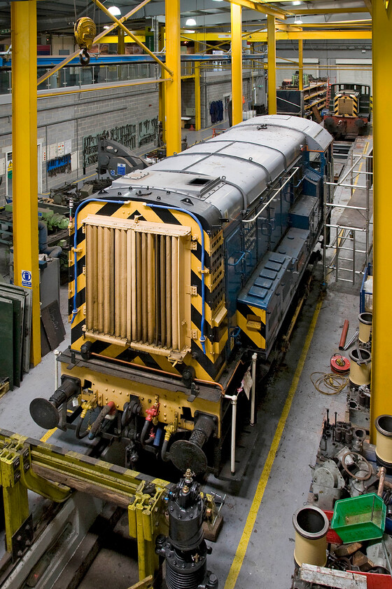 08911, undergoing repair, NRM 
 Entering service in August 1962 08911 operated throughout the north-west until withdrawl came in 2004 from Carlisle. It is now one of the NRM's residnet shunters used for moving exhibts around the museum's complex of tracks. Itbis seen in the repair shop undergoing some sort of maintance. 
 Keywords: 08911 undergoing repair NRM Gronk