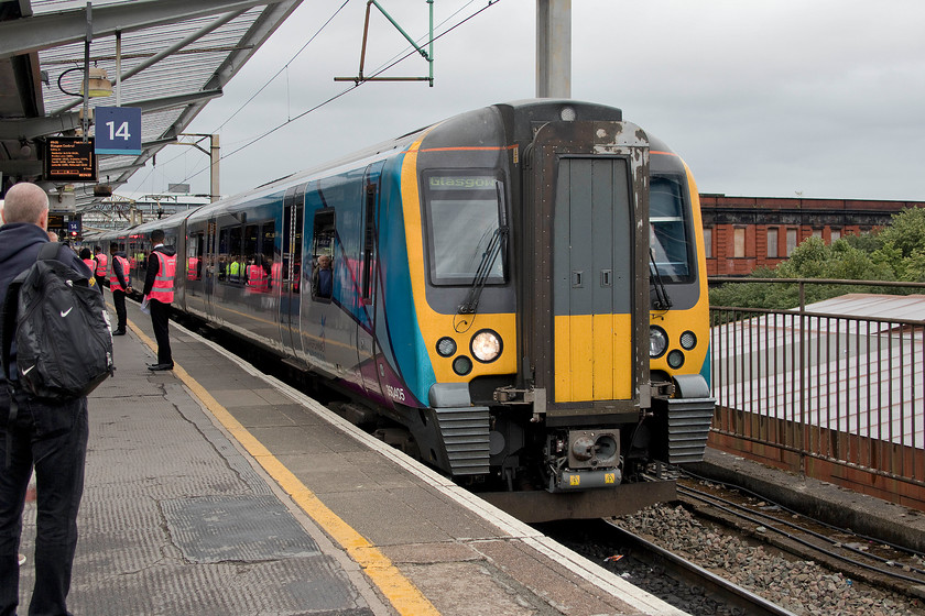 350405, TP 09.10 Manchester Airport-Glasgow Central (1S40, 6L), Manchester Piccadilly station 
 With pink hi-viz much in evidence preventing passengers going 'over the yellow line' 350405 arrives at Manchester Piccadilly's platform fourteen. It is working the 09.10 Manchester Airport to Glasgow Central that we took as far as Carlisle. It was interesting to compare these 3504XX units with our own 3501XX, 3502XX and 3503XX units that are operated by London Northwestern. They were smart inside with attractive seating and interiors and in much better condition than their older cousins. There are also seat reservations and it had an at-seat trolley service. Both Mike and I commented that they seemed to ride better and were quieter but they are a lot newer I suppose dating from 2013/14. 
 Keywords: 350405 09.10 Manchester Airport-Glasgow Central 1S40 Manchester Piccadilly station