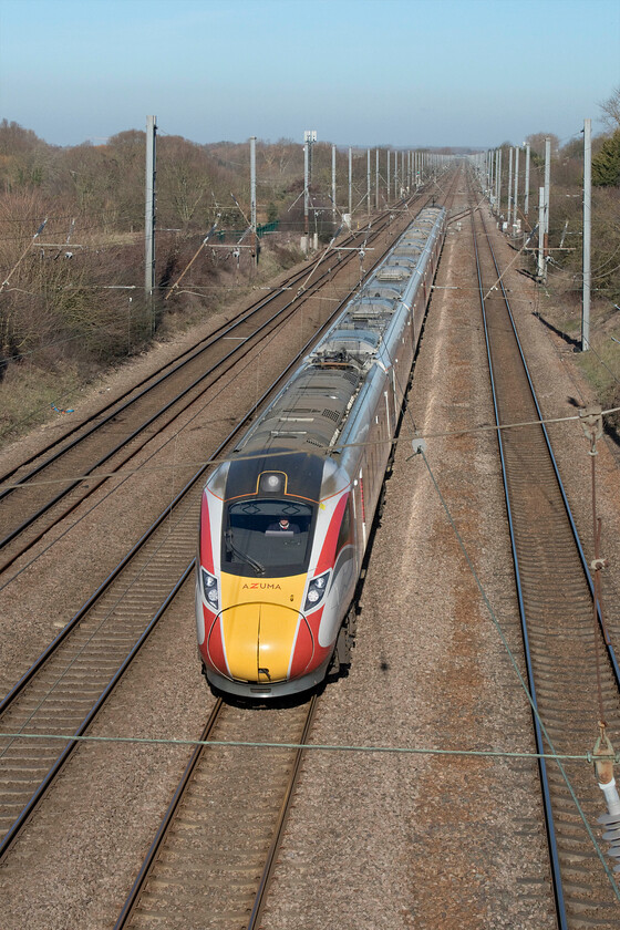 801229, GR 06.48 Glasgow Central-London King's Cross (1E06, 2L), Ickleford TL188317 
 801229 approaches the camera at a considerable speed working the 06.48 Glasgow central to King's Cross service. The train is seen from a footbridge the spans the busy ECML near the village of Ickleford in Hertfordshire. 
 Keywords: 801229 06.48 Glasgow Central-London King's Cross 1E06 Ickleford TL188317 LNER Azuma