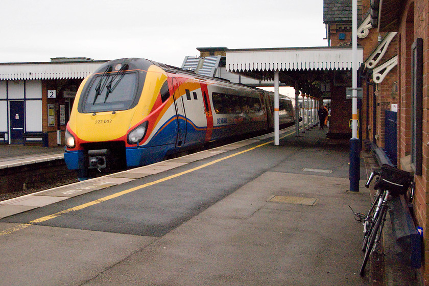 222002, EM 10.58 London St. Pancras-Sheffield (1F25), Wellingborough station 
 222002 passes through Wellingborough station with the 10.58 St. Pancras to Sheffield. Whilst considerably rationalised, Wellingborough station still retains many of its Midland characteristics and remains a pleasant station to use. One interesting feature at the southern end of platform one is its width. It is very narrow with the yellow line virtually against the wall! 
 Keywords: 222002 10.58 London St. Pancras-Sheffield 1F25 Wellingborough station