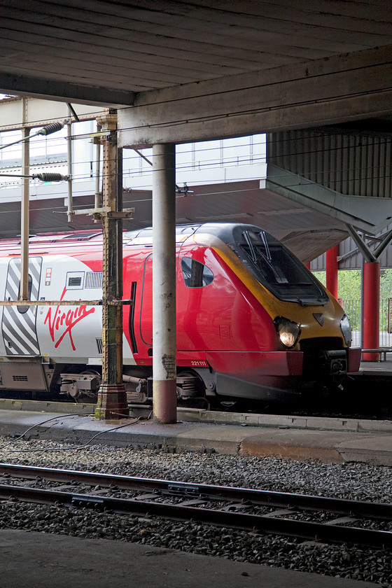 221111, VT 09.30 Barton-under-Needwood-Chester ECS (5D28), Crewe station 
 221111 'Roald Amundsen' pauses at Crewe station working the 09.30 Barton-under-Needwood to Chester ECS train. I pressure that this 5D28 working was some sort of positioning move following the Voyager receiving attention or undergoing an exam. at its base depot. 
 Keywords: 221111 09.30 Barton-under-Needwood-Chester ECS 5D28 Crewe station