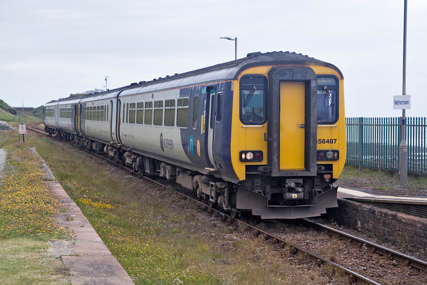 156487 & 156496, NT 13.15 Barrow-in-Furness-Carlisle (5C55, 3E), Nethertown station 
 Nethertown is up there in the top ten of the most remote stations in the country! It is located down a very steep and partially un-made road nestling between the sea and escarpment. As can be seen, the track was once double here but was singled in the past. Andy and I visited the station during our 2013 visit but saw no trains then. With a little more time on our hands this time around we were able to wait a little longer. 156487 is seen leading 156496 passing the station working the 13.15 Barrow-in-Furness to Carlisle service. 
 Keywords: 156487 13.15 Barrow-in-Furness-Carlisle 5C55 Nethertown station Northern