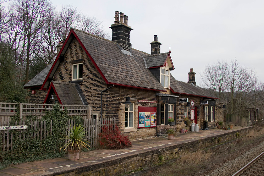 Former station building, Brockholes station 
 The present day Brockholes station has very limited facilities contained on a single platform some distance above the village of the same name. In this image, the old platform can be seen with the original station building. It has been tastefully restored complete with signage and working clock. This seems to be a far more appropriate way to preserve our proud heritage rather than simply razing it to the ground and building something new out of glass and concrete? 
 Keywords: Brockholes station