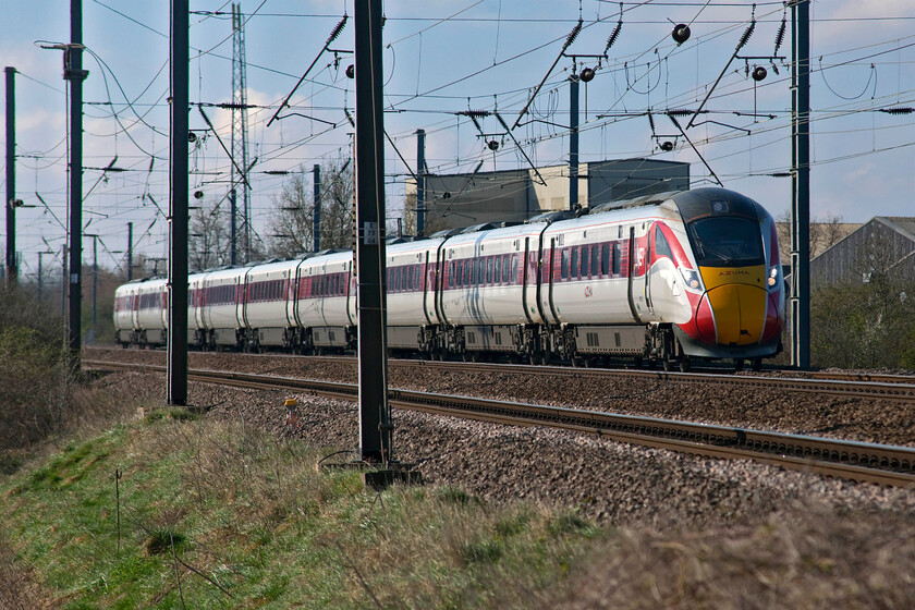 801210, GR 09.30 London King's Cross-Edinburgh Waverley (1S10, RT), Sandy TL176510 
 After a brilliant bright and cloudless start to the day, the cloud is gathering to the south emphasised by this zoomed photograph. It shows Azuma 801210 speeding past Sandy approaching New Zealand bridge with the 09.30 King's Cross to Edinburgh service. Despite their awful seating and poor levels of on-board facilities, the LNER versions of this design do look far better than the rather drab GWR versions that do appear a little underwhelming in the looks department and there speaks a Great Western lad born and bred! 
 Keywords: 801210 09.30 London King's Cross-Edinburgh Waverley 1S10 Sandy TL176510 LNER Azuma