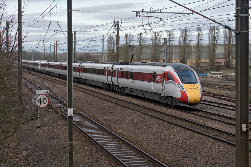 801110 & 800201, GR 08.58 York-London King's Cross (1Y14, 2L), Tallington 
 LNER's 1Y24 08.58 York to King's Cross service passes Tallington worked by 801110 and 800201. 1Y14 is normally the 06.55 from Newcastle however due to engineering works between Darlington and Newcastle a revised timetable was in operation with it re-cast as a York semi-fast service. I am not at all convinced as to the wisdom of running a twin set of units on a service such as this necessitating twin-manning throughout. 
 Keywords: 801110 800201 08.58 York-London King's Cross 1Y14 Tallington LNER Azuma