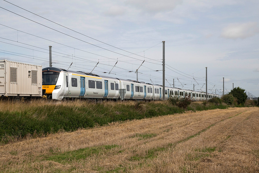 700132, 03.14 Dollands Moor-Hornsey EMUD (Via Peterborough) (6X71), Holme Green TL192420 
 700132 being towed past Holmes Green south of Biggleswade on a gauging run as the 6X71 03.14 Dollands Moor to Hornsey EMUD via Peterborough. It won't be long before these brand new shiny units are in service on this line providing a substantial increase in capacity for commuters in and out of King's Cross. As for their quality, like with all new trains, time will tell! 
 Keywords: 700132 03.14 Dollands Moor-Hornsey EMUD 6X71 Holme Green TL192420