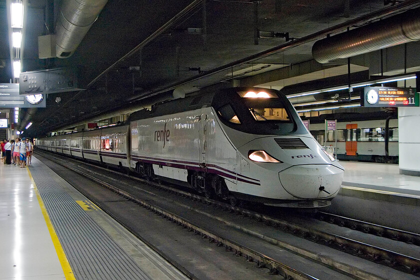 130 025, Renfe 17.30 Barcelona-Sants-Madrid Atocha via Valencia, Barcelona-Sants station 
 Rather comically referred to as Ducklings, the Renfe Class 130s are technically impressive trainsets being multi-mode as well as dual gauge. In fact, they can change gauges whilst moving relatively slowly thus able to take advantage of both the standard and Iberian (1,668 mm) gauges. They are not as fast as some of the other Renfe trains but they are far more versatile. 130 025 waits to leave Barcelona Sants station with the 17.30 to Madrid taking the coastal route via Valencia. 
 Keywords: 130 025 Renfe 17.30 Barcelona-Sants-Madrid Atocha via Valencia, Barcelona-Sants station