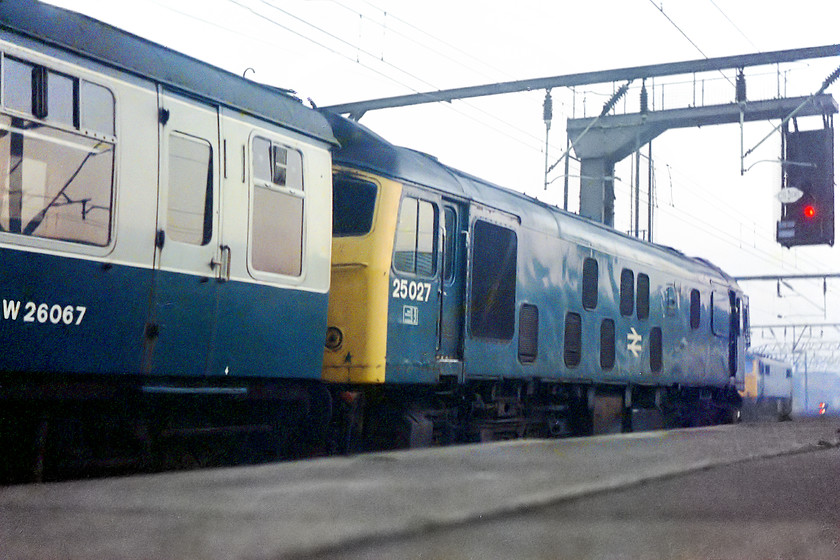 25027, unidentified Crewe-Cardiff Central working, Crewe station 
 25027 waits to leave Crewe station with a working to Cardiff Central. The 25s were regular performers on this route for quite sometime until the 33s began to make inroads. Equally, a class 47 could turn up on a working. Note my trademark low angle shot, perhaps it was getting dark and I was having to use a slow shutter speed and I needed my trusty rucksack to act a support; no tripod in those days! 
 Keywords: 25027 Crewe Cardiff central