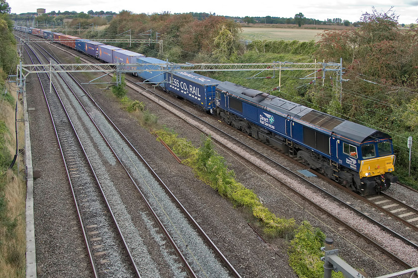 66424, 13.00 DIRFT-Purfleet (4L48), Victoria Bridge 
 A pretty dependable and regular Sunday freight on the southern WCML is this one, the 4L48. It works as the 13.00 from Daventry Railfreight Depot to Tilbury and is seen with 66424 at the head in its revised DRS livery of all-over deep blue with white and light blue logo with white numbers. 
 Keywords: 66424 13.00 DIRFT-Purfleet 4L48 Victoria Bridge