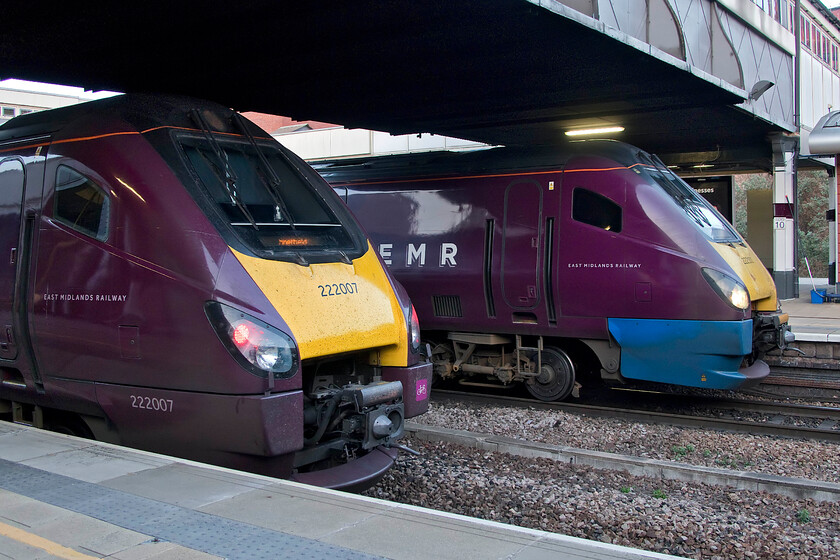 222007, EM 17.02 London St. Pancras-Sheffield (1F60, RT) & 222101, EM 17.50 Nottingham-London St. Pancras (1B79, 3E), Leicester station 
 A study of two Meridians as they pause at Leicester station. Furthest away is former Hull Trains' unit 222101, once named 'Professor George Gray', wearing a fairing that appears to have been a spare part from an EMT unit. This Meridian is working the 1B79 17.50 Nottingham to St. Pancras service. Nearest the camera is the rear end of 222007 'City of Derby' working the 1F60 17.02 St. Pancras to Sheffield train. 
 Keywords: City of Derby 222007 17.02 London St. Pancras-Sheffield 1F60 222101 17.50 Nottingham-London St. Pancras 1B79 Leicester station East Midlands Railway EMR Meridian