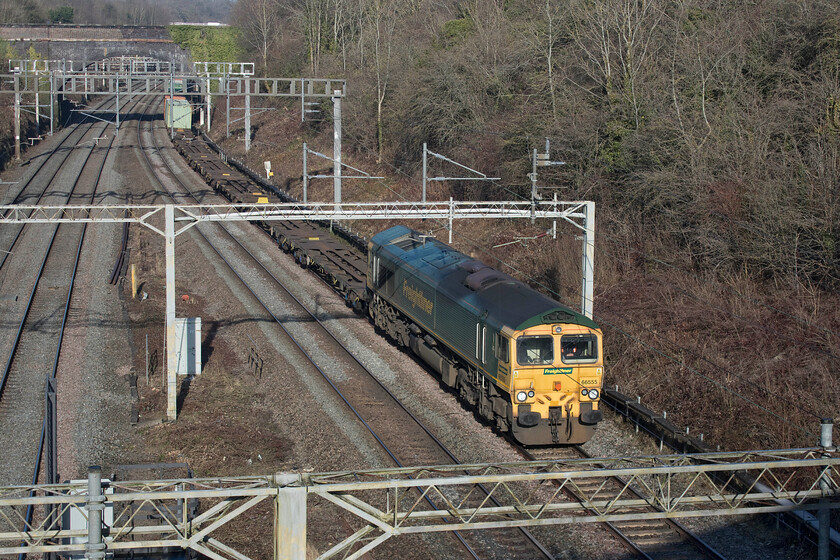 66555, 08.21 Crewe Basford Hall-London Gateway (4L59, 1E), A508 bridge 
 66555 leads the 4L59 Basford Hall to London Gateway Freightliner service out of Roade cutting about to pass under the village of the same name A508 road bridge. In the coming few months this road number will change as the very busy road is downgraded following the opening of the long-awaited and much anticipated bypass. 
 Keywords: 66555 08.21 Crewe Basford Hall-London Gateway 4L59 A508 bridge Freightliner