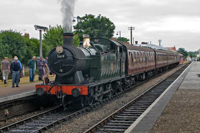 5619, 12.00 Sheringham-Holt, Sheringham station 
 Working on the wrong side of the country! The Collett-designed GWR 5600 Class were always associated with South Wales seeing almost exclusive use on coal trains so to see one in Norfolk is a little incongruous! 5619 has been a long-term guest locomotive on the North Norfolk Railway since the start of the 2010 season. Attracting a lot of attention on the platform end, 5619 will soon depart from Sheringham with the 12.00 service to Holt. 
 Keywords: 5619 12.00 Sheringham-Holt Sheringham station