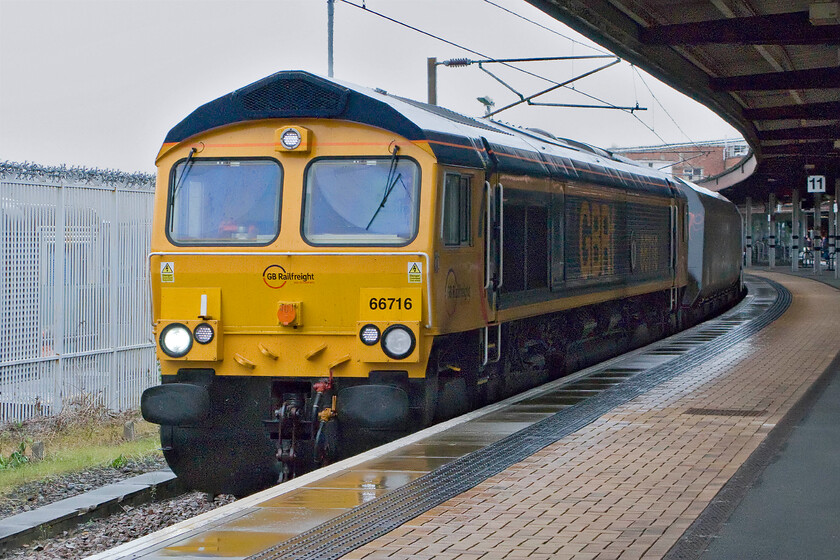 66716, 10.37 Butterwell opencast-Cottam power station, York station 
 66716 'Locomotive & Carriage Institution Centenary 1911-2011' hauls another loaded coal train south to feed the fuel-hungry Cottam power station just to the east of Retford through York station. It is leading the 10.37 ex Butterwell opencast loading pad that is located on a short spur off the ECML just north of the town of Ashington. With the ever-dwindling number of coal-fired power stations as part of the decarbonising agenda then trains like this are set to become pretty rare; get them while you can! 
 Keywords: 66716 10.37 Butterwell opencast-Cottam power station York station 66716 Locomotive & Carriage Institution Centenary 1911-2011