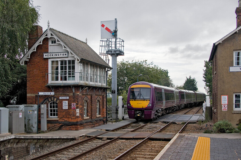 170204 & 170504, EM 15.12 Skegness-Nottingham (2O20, 15L), Heckington station 
 170204 and 170504 leave Heckington station working the 15.12 Skegness to Nottingham service. The train has just passed the superb 1876 Great Northern signal box that has featured in so many photographs over the years. It's such a shame that the scene has been spoilt by Network Rail's installation of the vastly over-engineered signal post. The galvanised box section structure is in stark contrast to the slotted concrete GER post that I photographed back in 1980, see.... https://www.ontheupfast.com/p/21936chg/29682547404/heckington-signal-box 
 Keywords: 170204 170504 15.12 Skegness-Nottingham 2O20 Heckington station