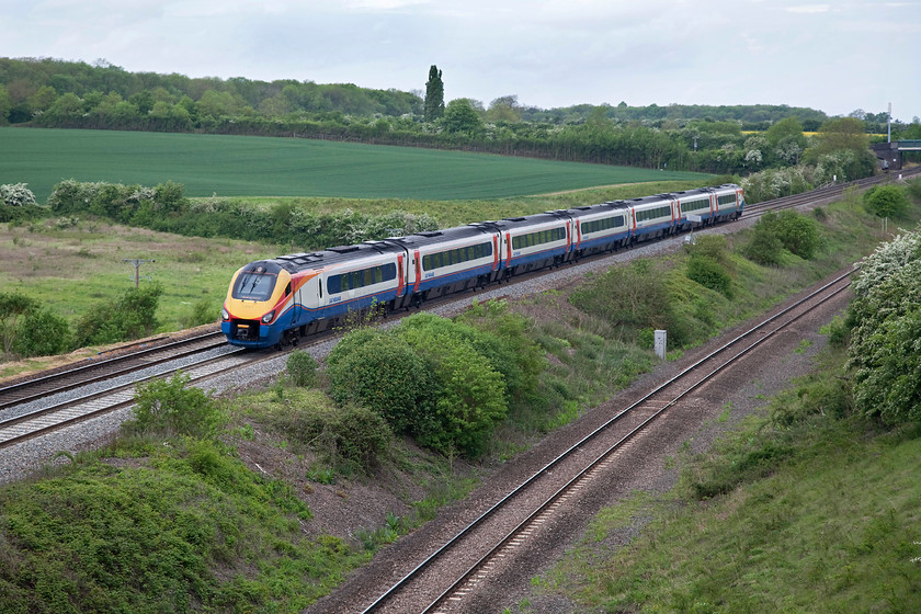 222003, EM 09.29 Sheffield-London St. Pancras (1C30, 3L), Souldrop Road Bridge SP986609 
 A lovely open scene that makes the taking of pictures of trains so easy! However, by 2019 this scene will change for ever as the electrification posts, stanchions and wires blight it for ever. So, whilst it can still be enjoyed here is 222003 'Tornado' races south forming the 09.29 Sheffield to St. Pancras. Notice the single slow line at a slightly lower level. There is talk that this could be re-doubled from Sharnbrook Junction through the tunnel, to Wellingborough and Harrowden Junction retuning it to as it was up until it was singled in 1987. 
 Keywords: 222003 1C30 Souldrop Road Bridge SP986609