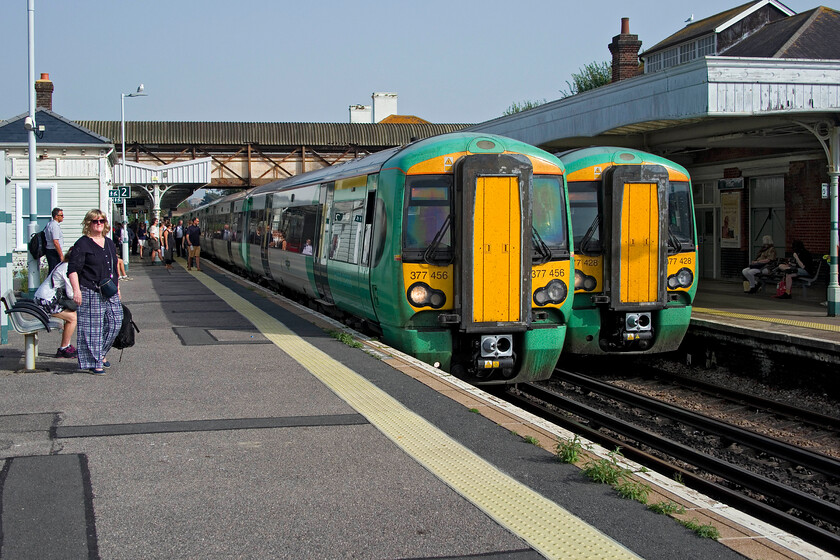 377456, SN 14.46 London Victoria-Littlehampton (1H36, 9L) & 377428 SN 16.00 Brighton Portsmouth Harbour (cancelled from Chichester) (1S28, 12L), Hove station 
 A pair of Southern Electrostars are seen at Hove station in the hot afternoon sunshine however, all is not well. The onboard announcement on 377428 suggested that passengers for certain stations, including my intended destination, Littlehampton, should alight and take the next train from platform two. This was due to some sort of signalling fault that eventually caused the 16.00 Brighton to Portsmouth Harbour to be terminated at Chichester. I travelled on 377456 working the 14.46 London Victoria all the way to its destination, Littlehampton, leaving the 1S28 to its fate! 
 Keywords: 377456 14.46 London Victoria-Littlehampton 1H36 377428 16.00 Brighton Portsmouth Harbour cancelled from Chichester 1S28 Hove station Southern Electrostar