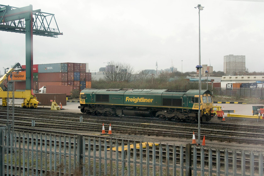 66532, stabled, Landore Street FLT 
 Taken from the train through a grubby window, 66532 'P&O Nedlloyd Atlas' stands stabled in Landore Street Freightliner terminal in Birmingham. The odd name of this 66 that it was awarded in 2002 is after the Anglo Dutch operator P&O and Nedlloyd that was formed in 1998. The term Atlas refers to a 40 and 45 foot design of container that has become a highly successful one throughout the world of shipping. 
 Keywords: 66532 Landore Street FLT