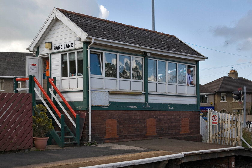 Bare Lane signal box (LMS, 1937) 
 Bare Lane signal box was opened by the LMS in 1937 being to a rare (today with few surviving) 11C design. The box shut six months ago in December 2012 and has had its innards largely removed now operated by staff from Northern. Trains. This strange turn of events has been caused by a delay in the design and installation of illuminated passenger information screens and audio with the signal box now serving in the interim as an impromptu platform announcement cabin to serve the travelling public. It is likely that this situation will continue until the end of this year with demolition of the structure due sometime next year.

PS Demolition took place in January 2014, there is a Youtube video link here.... https://www.youtube.com/watch?v=d6z9YXGEnFU 
 Keywords: Bare Lane signal box LMS, 1937