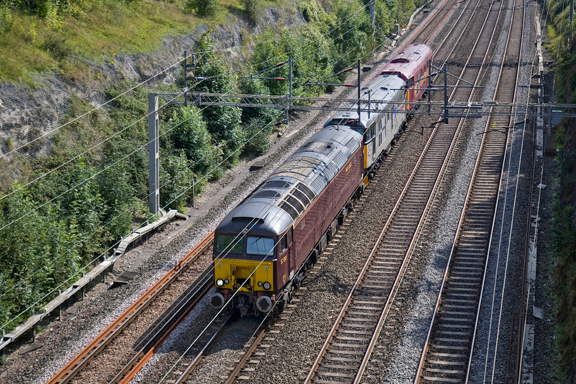 57315, 31271 & 31466, 09.22 Alton-Etches Park (OZ43), Roade cutting 
 I had been tracking the progress of the 0Z43 all day with it due to pass through Roade a short time before my booked time for donating blood. If it started to lose time I would be forced to miss it but, fortunately, it was running bang-on time so it is seen here passing through the cutting. Led by WCR's 57315 31271 'Stratford 1840-2001' and 31466 are running as the 09.22 Alton to Derby Etches Park. The duo of Class 31s are firm favourites on the heritage line circuit being popular for rail galas providing some double-headed English Electric relief for enthusiasts! 
 Keywords: 57315 31271 31466 09.22 Alton-Etches Park OZ43 Roade cutting WCR West Coast Railways Stratford 1840-2001