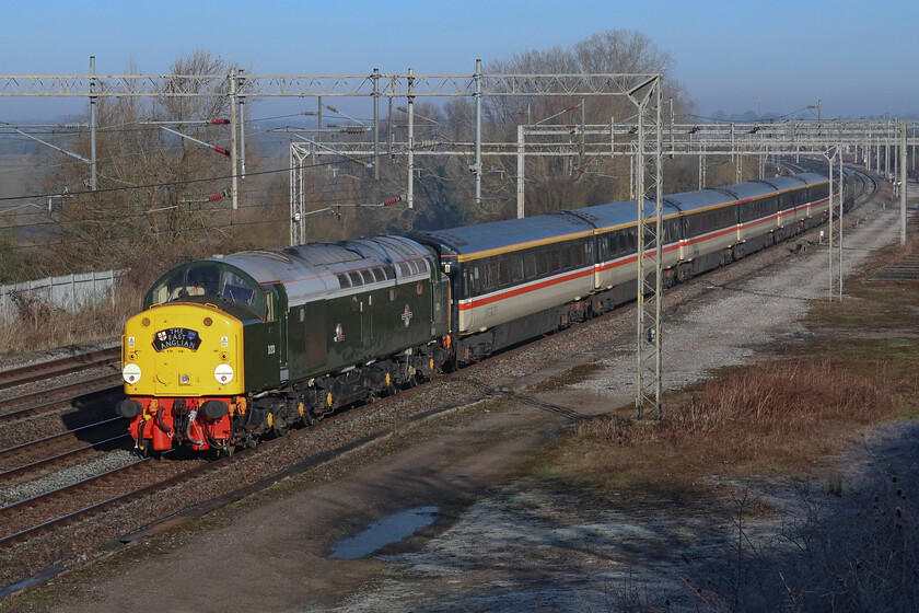 D213, outward leg of The East Anglian 2, 06.39 Crewe-Norwich (1Z31, 2E), Gordon's Lodge 
 A glorious sight and sound as D213 'Andania' revisits its old haunts hauling the outward leg of The East Anglian 2 charter passing Gordon's Lodge just north of Hanslope Junction on the southern WCML. Of course, back in the day the heavyweight Type 4 would have been more at home on the fast lines rather than the up slow that it is travelling on here. The LSL organised 1Z53 06.39 Crewe to Norwich charter ran to time both on its outward and return journey via North London. 
 Keywords: D213 The East Anglian 2 06.39 Crewe-Norwich 1Z31 Gordon's Lodge Andania