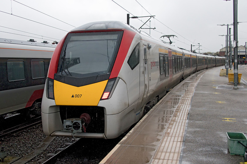 745007, LE 16.00 Norwich-London Liverpool Street (1P51, 2L), Norwich station 
 There is no denying that the Stadler built FLIRT units look very smart in their Greater Anglia livery even in the pouring rain as seen here at Norwich! The Class 745 units are composed of twelve cars and were introduced to this route in January of this year (2020) with squadron service having come very quickly allowing the elderly Mk.III/Class 90 sets to be withdrawn. 745007 will soon work the 16.00 to Liverpool Street with one of its Stansted Express cousins stabled in the adjacent siding. 
 Keywords: 745007 16.00 Norwich-London Liverpool Street Norwich station stadler FLIRT