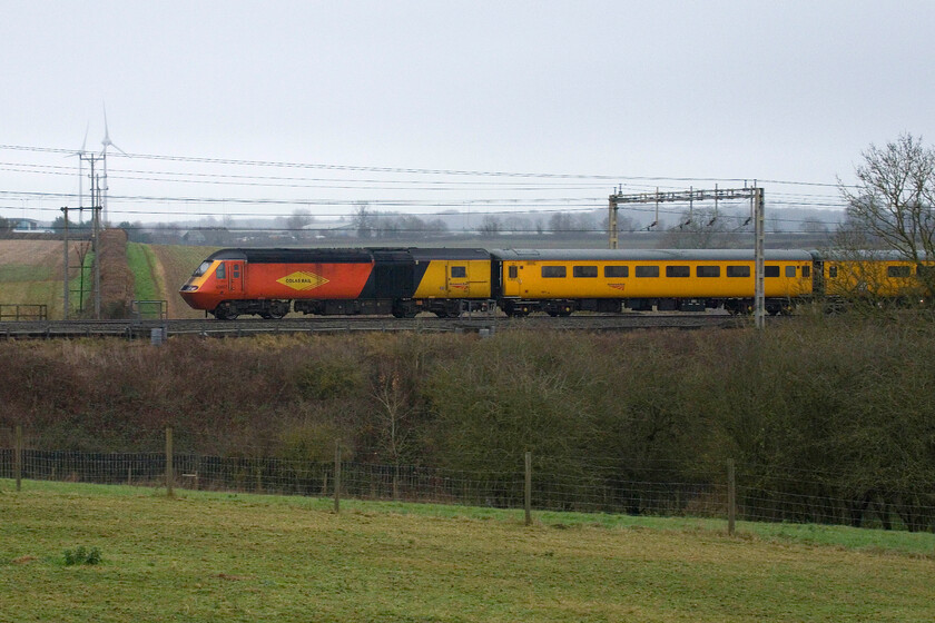 43257, 11.59 Crewe Pottery Loop-Derby RTC, (1Q29, 18E), between Roade & Ashton 
 43257 brings up the rear of the 11.59 Crewe Pottery Sidings to Derby RTC NMT train that takes a convoluted route around most of the Midlands to reach here just south of Roade on the WCML. 43257 is an interesting power car being one of the pair that made up ECML pioneer set 254001 that entered service in 1977. Now wearing its Colas livery it will, on another day, be hauling a test train on the very tracks that it first operated on nearly fifty years ago. 
 Keywords: 43257 11.59 Crewe Pottery Loop-Derby RTC 1Q29, 18E), between Roade & Ashton