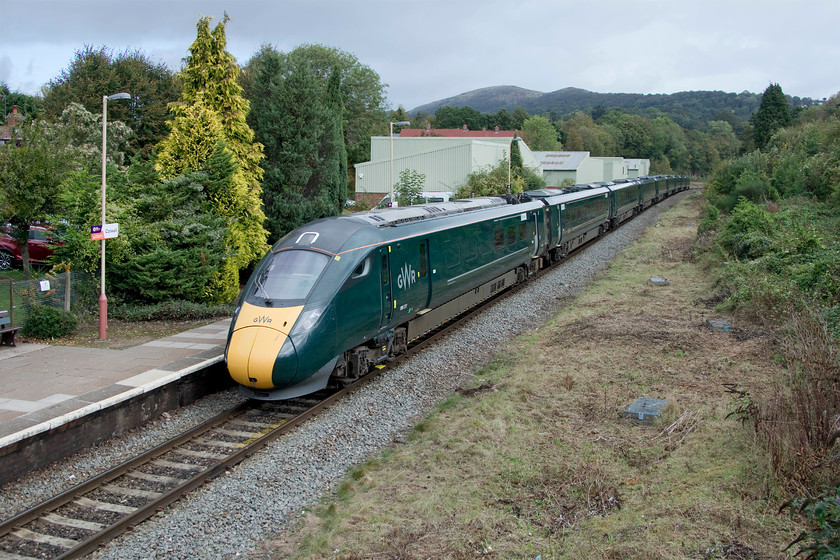 800311, GW 08.22 London Paddington-Hereford (1W00, RT), Colwell station 
 Colwell station is nestled to the western side of the Malvern Hills that are clearly seen in this image. It is a single platform affair but in this image, it was clearly once much larger with a double track. It also had a signal box and some typical Great Western station buildings, the only survivor being the footbridge that I am standing on. Having taken over from the HSTs earlier in the year, 800311 arrives at Colwell working the 08.22 Paddington to Hereford service. The train has one more stop at Ledbury before reaching its destination in about fifteen minutes time. 
 Keywords: 800311 08.22 London Paddington-Hereford 1W00 Colwell station