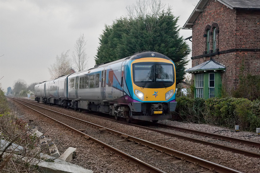 185127, TP 16.56 Liverpool Lime Street-Scarborough (1E45, 11L), Strensall level crossing 
 185127 passes Strensall with the 16.56 Liverpool Lime Street to Scarborough 1E45 service. It is about to pass over the level crossing that divides the village in half and is just passing the former station building that closed on 22.03.1930. 
 Keywords: 185127 16.56 Liverpool Lime Street-Scarborough 1E45 Strensall level crossing