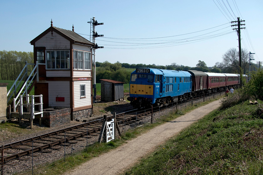 31289, 13.00 Pitsford return, Pitsford sidings 
 Under absolutely stunning blue skies, 31289 'Phoenix' passes the well restored Pitsford Sidings signal box with the 13.00 Pitsford return 'Easter egg' special. This lovely LNWR 1903 box was originally at Wolverton Works being erected here at Pitsford sidings in 1997. 
 Keywords: 31289 13.00 Pitsford return Pitsford sidings