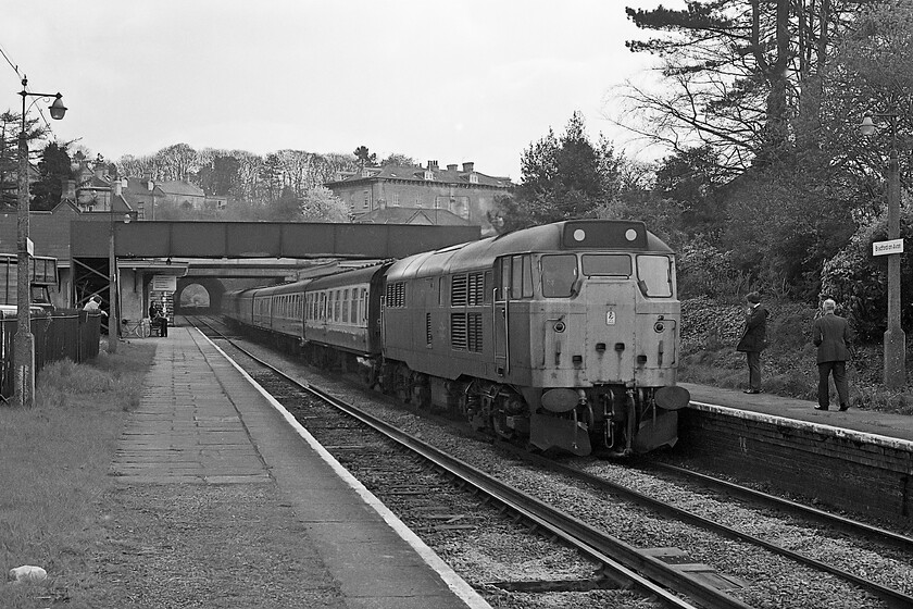 Class 31, unidentified Portsmouth Harbour-Bristol Temple Meads working, Bradford-on-Avon station 
 I started out my out and back tour of the Avon Valley on this spring afternoon at Bradford-on-Avon station. In this scene, an unidentified Class 31 wearing mini snowploughs drifts into the station with passengers waiting on the platform to head on towards Bath and Bristol. It must have been a chilly May day as it appears that the 31 has its steam heat boiler running judging by the small whisps emanating from the coaches. Close examination of the station building reveals my bike leaning against the wall ready to take me further along the valley. 
 Keywords: Class 31 Portsmouth Harbour-Bristol Temple Meads working Bradford-on-Avon station