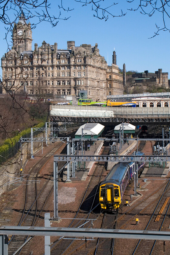 158733, SR 14.35 Edinburgh Waverley-Perth, Edinburgh Waverley station from The Mound 
 With the impressive and iconic North British Station Hotel dominating the skyline 158733 leaves Edinburgh Waverley station working the 14.35 service to Perth. In order to take this photograph I am standing on the area known as The Mound. 
 Keywords: 158733 14.35 Edinburgh Waverley-Perth Edinburgh Waverley station from The Mound ScotRail