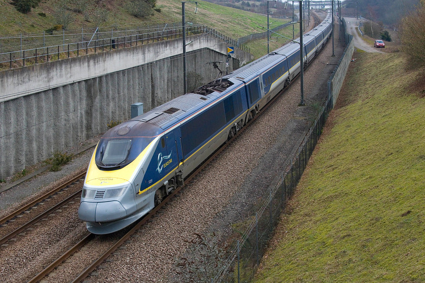 373221, ES 10.56 Brussels Midi-London St. Pancras International (9129), Sandling TR145369 
 Having emerged from the Channel Tunnel some three miles ago, 373221 is still working up to it maximum speed with the 10.56 Brussels Midi to St. Pancras International. The train is passing a spot just adjacent to Sandling station that is on the 'classic' route. Close examination of the image reveals that the train is just about sharp using 1/1600 sec. I have never taken a picture of a Eurostar working at 300kmh but I suspect that even the camera's maximum 1/2000 sec. shutter speed would struggle to keep things under control! 
 Keywords: 373221 10.56 Brussels Midi-London St. Pancras International 9129 Sandling TR145369