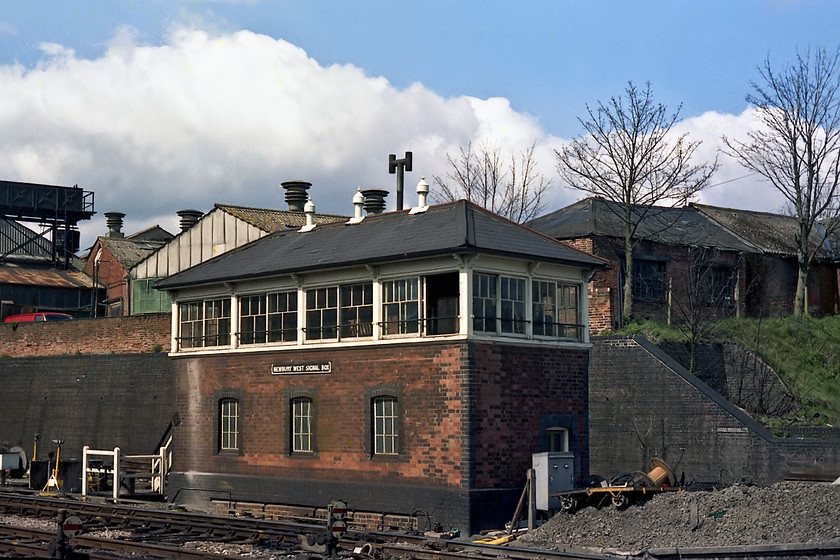 Newbury West signal box, (GWR, date not known) 
 At the country end of Newbury station was Newbury West signal box. At this point in time it was the fringe box from the Reading panal. It controlled the tracks at the western end of the station and the associated signalling of which there was a fair amount. Again, as with Newbury Middle, I have no date of construction but as its one of the GW's later hipped roof design with blue bricks for the corners it has to be post 1896. Notice the work of the PW gang all around the box. Soon, the track layout was considerably rationalised with new MAS signalling installed and the Victorian infrastructure swept away. 
 Keywords: Newbury West signal box, GWR, date not known