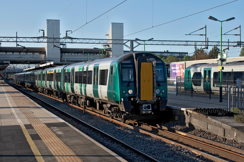 350372, LN 07.24 London Euston-Northampton (2N49, 3E) & Class 350, LN 06.24 Crewe-London Euston (1U16, 6L), Bletchley station 
 Desiros passing at Bletchley. As 350372 gets away from the station working the 07.24 Euston to Northampton service another unidentified unit passes south at speed on the 1U16 06.24 Crewe to Euston service. With the completely clear blue sky it was an absolutely stunning September morning with a distinct chill in the air. 
 Keywords: 350372 07.24 London Euston-Northampton 2N49 Class 350 06.24 Crewe-London Euston 1U16 Bletchley station London Northwestern Desiro