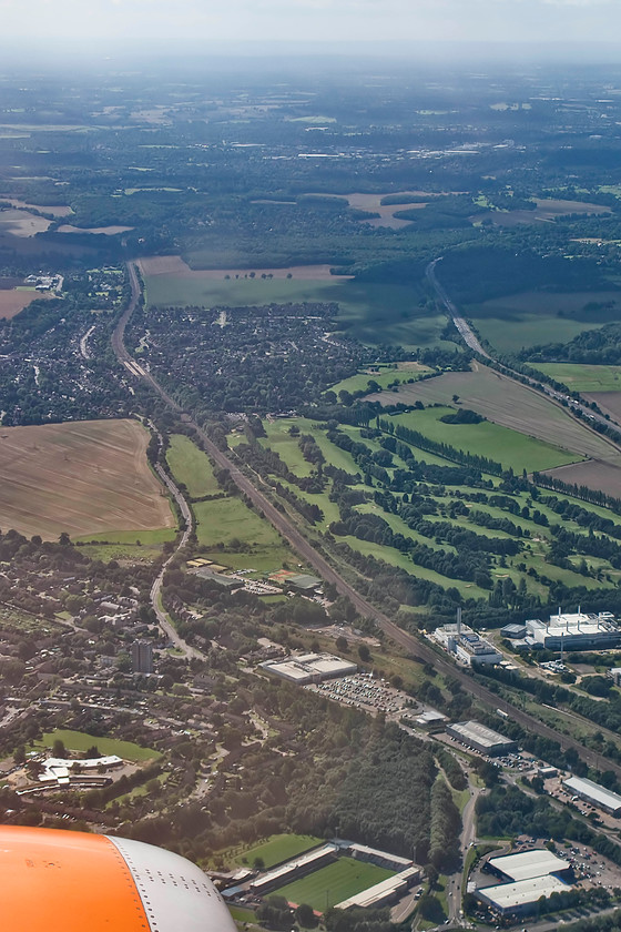 ECML & Knebworth, from EZY2446 
 Continuing on the final descent to Luton airport on easyjet flight EYZ2446 finds us crossing the ECML directly over Stevenage with Knebworth and its station in view. Between the railway and the A1(M) ar the manicured fairways of Knebworth Golf Club. 
 Keywords: ECML & Knebworth, from EZY2446 easyjet