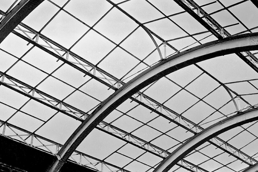 Roof, Bath Green Park station 
 Looking up to the sky through the remains of the once fine wrought-iron roof. Contrary to what many think is the case the lack of glass did not come about after the station's closure in 1967 but was removed during the Second World War when the station was damaged by enemy bombings as part of the so-called Baedeker Raids. It was never reinstated. 
 Keywords: Roof Bath Green Park station