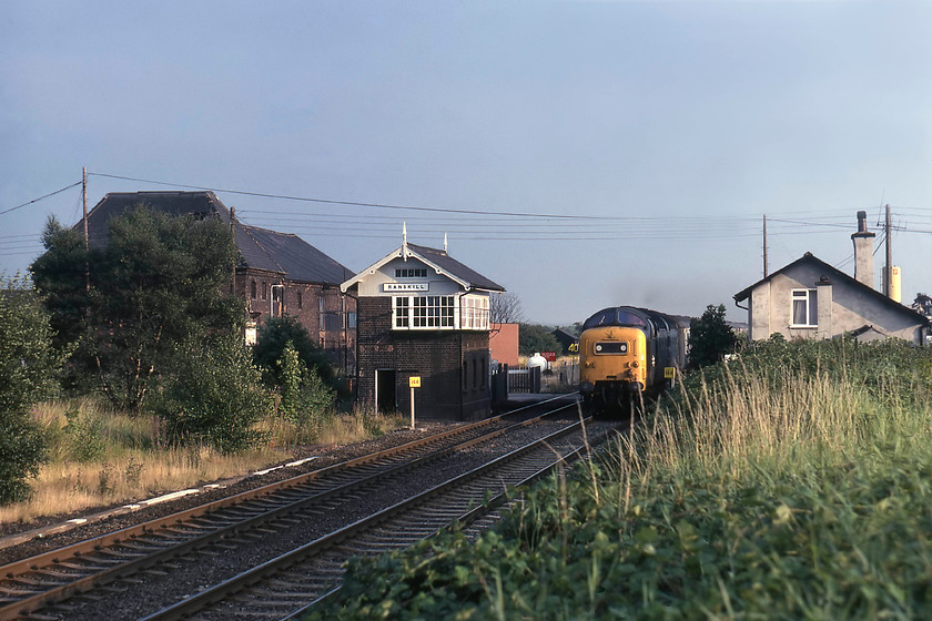 55008, 17.05 London King`s Cross-Hull (1D04), The Hull Executive, Rankskill SK661878 
 As the afternoon progressed, the weather improved with some welcome sunshine by early evening. 55008 'The Green Howards' is at full speed passing Ranskill with the 17.05 King's Cross to Hull, the fabled Hull Executive. I have deliberately taken the picture a little early for two reasons. Firstly, I wanted the c.1875 Great Northern signal box in the image and secondly, my Zenith camera had a paltry maximum shutter speed of 1/500th second so if the train had been much closer it would have been very blurred! The box still stands and, at the time of writing, is in use containing a mini-panel monitoring all of the crossings between Bawtry and Gamston. Notice the milepost just in front of the Deltic indicating that Ranskill crossing is one hundred and forty-four miles from London. 
 Keywords: 55008 17.05 London King`s Cross-Hull 1D04 The Hull Executive Rankskill SK661878