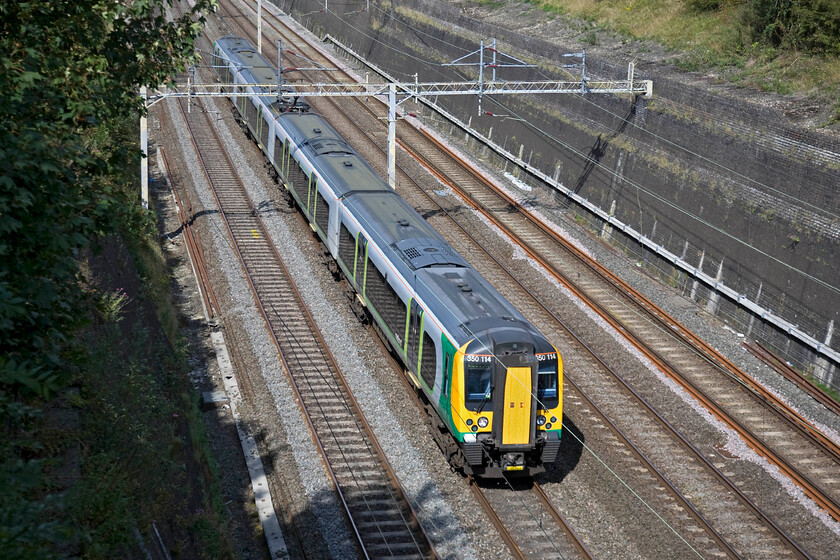 350114, LM 11.02 Crewe-London Euston (1U28), Roade cutting 
 350114 heads south through Roade cutting in some pleasant afternoon sunshine working the 11.02 Crewe to Euston service. 
 Keywords: 350114 11.02 Crewe-London Euston 1U28 Roade cutting London Midland Desiro