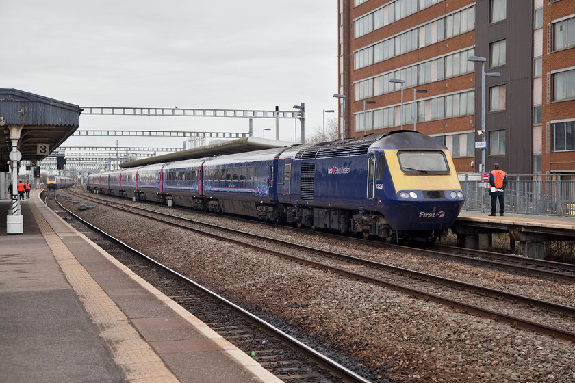 43128 GW 10.15 London Paddington-Cardiff (1B22), Swindon station 
 Arriving at Swindon's 'new' platform 4 which opened in 2003 is 43128 leading the 10.15 London Paddington to Cardiff Central working. As part of set 253029, 43128 was one of a second batch of HSTs delivered to the Western Region in the summer of 1981. This was part of the programme to extend HSTs services from London to the south west that led to the gradual demise of locomotive hauled services on this route. At the time of writing in June 2018, 43128 has just gone off-lease and moved to Derby and then on to open storage at Papworth Sidings in Ely. 
 Keywords: 43128 1C09 Swindon station